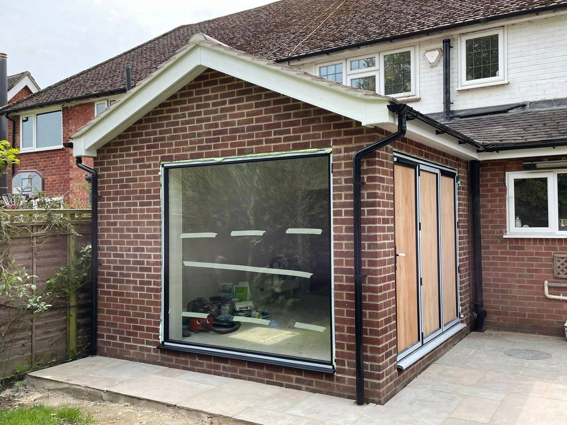 Newly built house extension with rear patio — Philbert Construction project in Berkshire