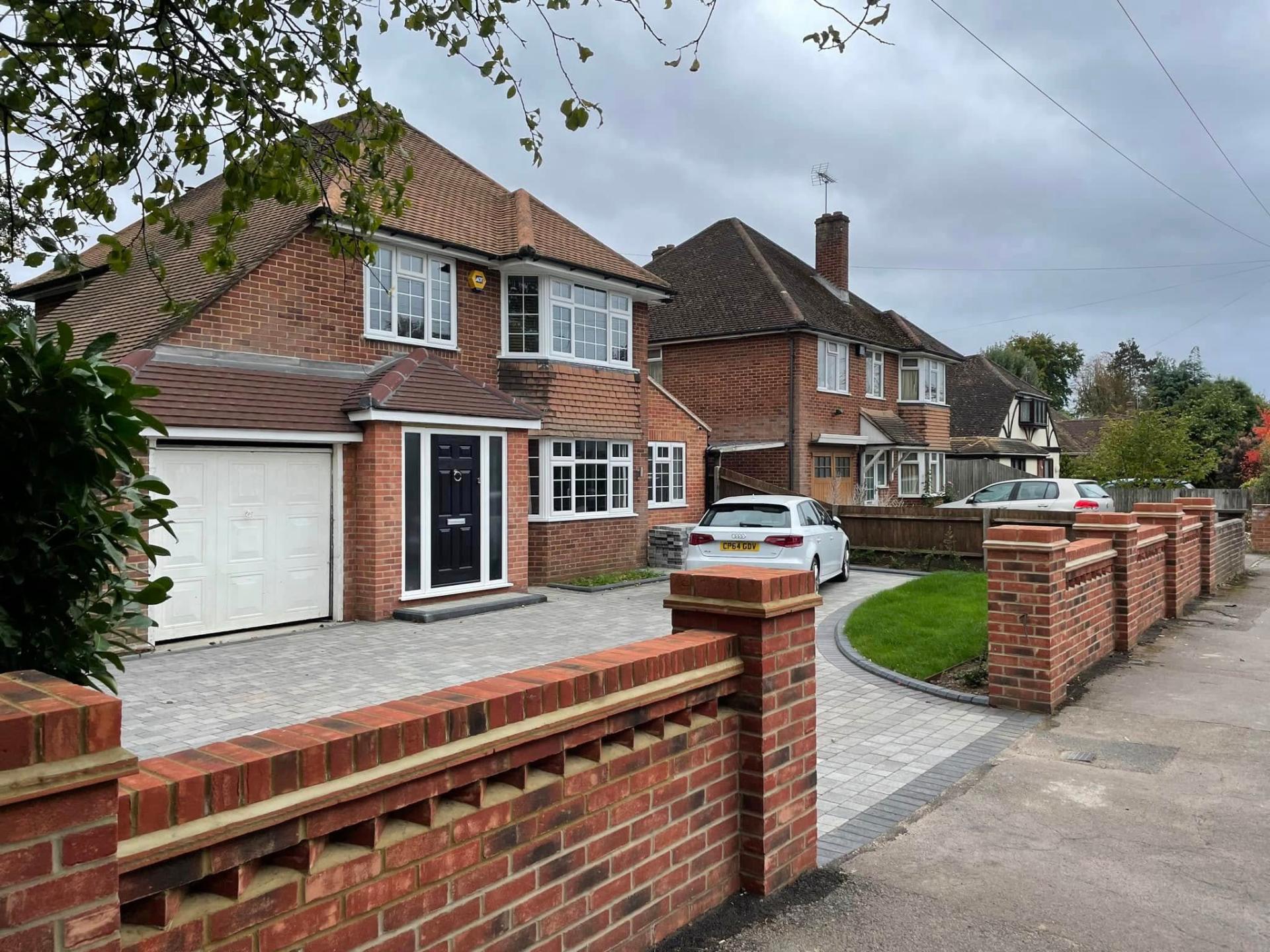Block paving driveway with front wall