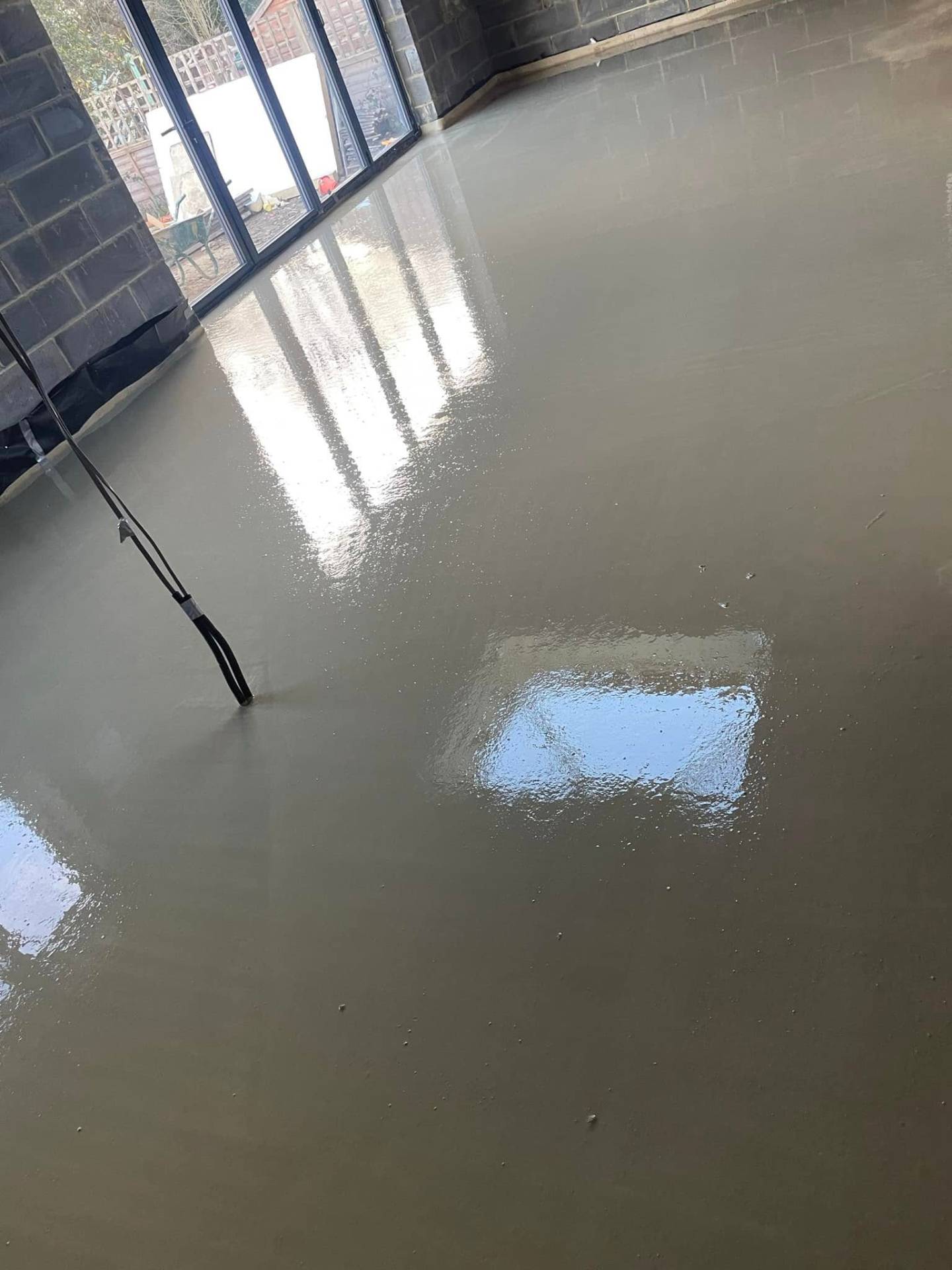 new concrete floor inside extension — Philbert Construction extensions project in Reading