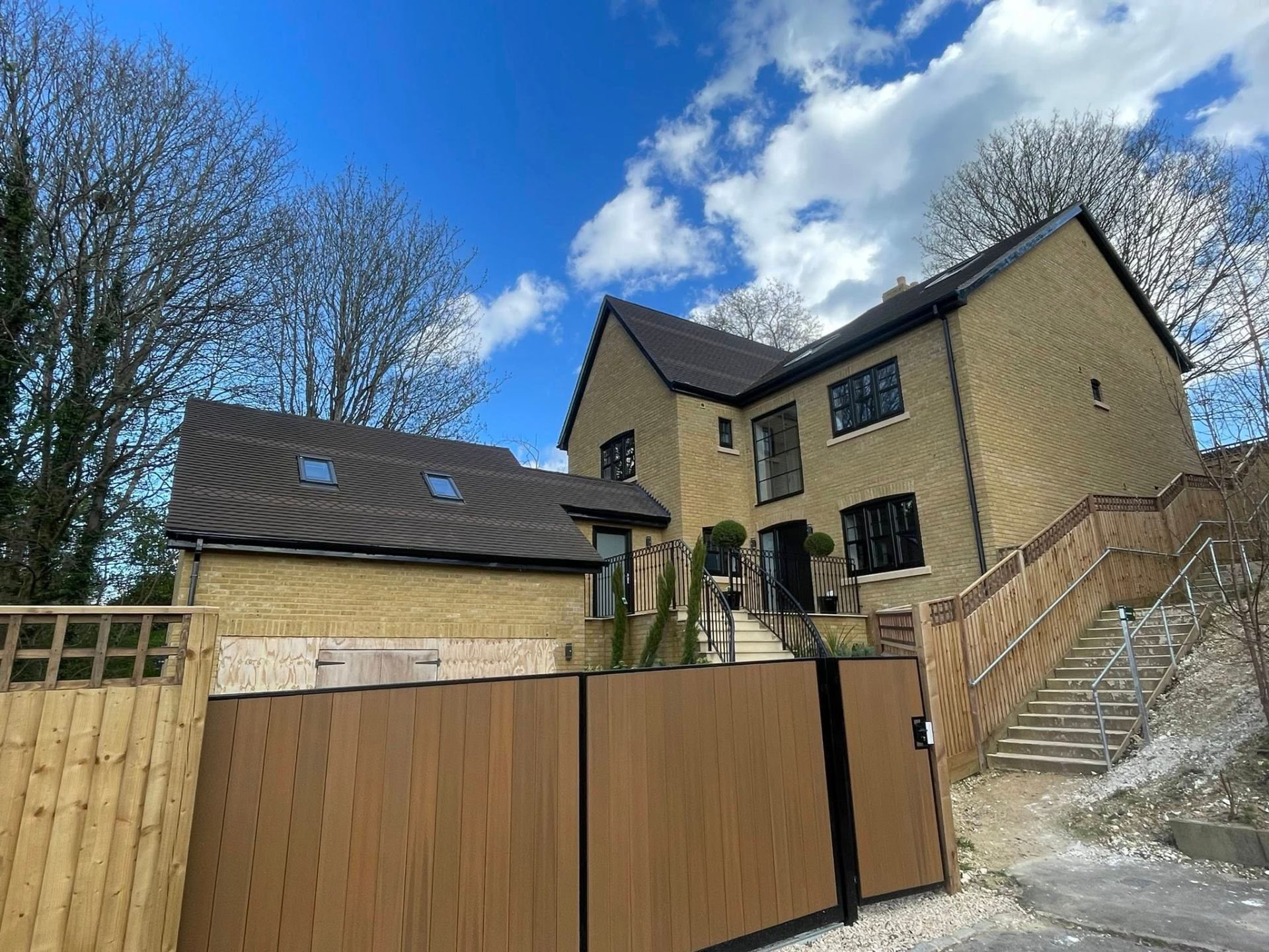 New build house with roof, fences, and stairs — Philbert Construction extensions project in Reading
